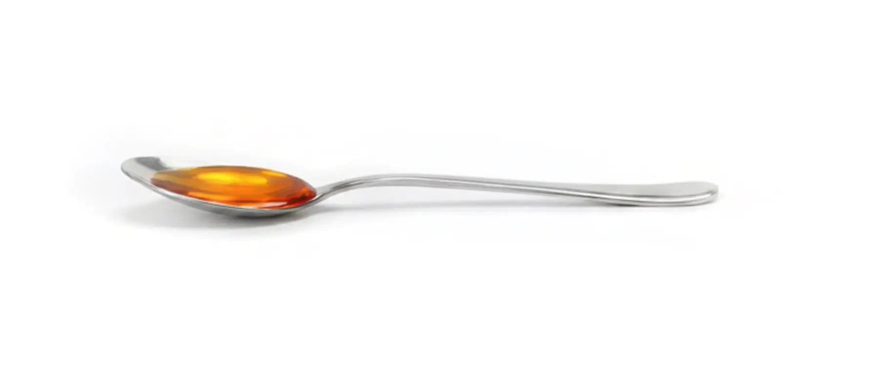 Löffel mit goldenem Öl